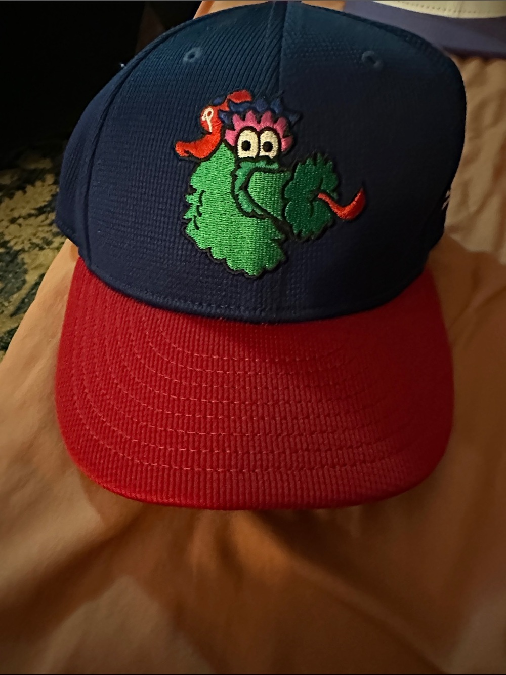 Phillies New Era Blue and Red Snapback Hat with Green Mascot Embroidery